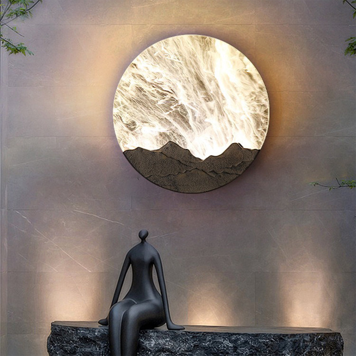 Illuminated circular wall sconce creating warm ambient lighting with natural marble aesthetic