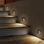 Modern staircase with integrated recessed step lighting creating dramatic illumination