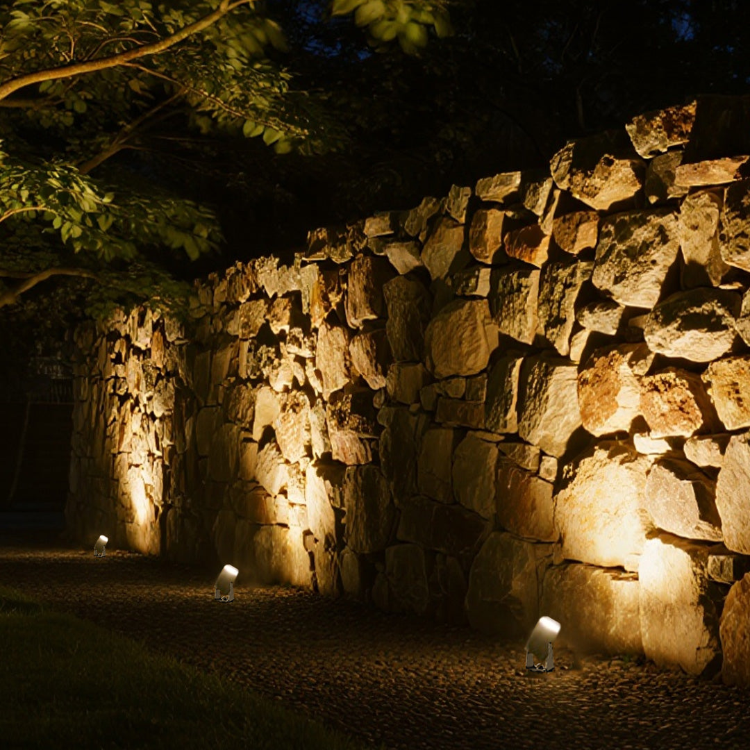 Landscape stakes for landscape lights highlighting ornamental tree in modern courtyard design