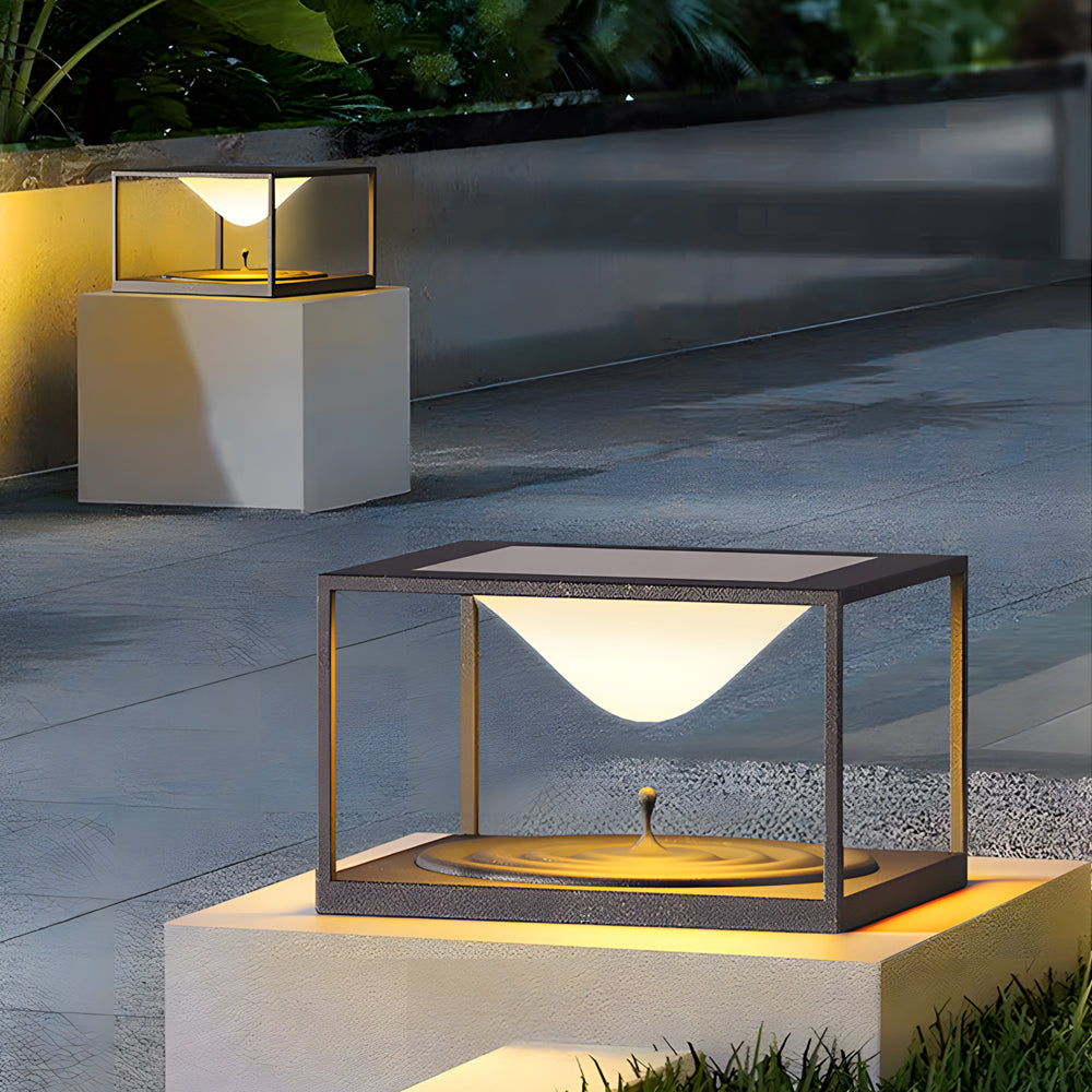 Stylish LED accent lights installed on modern concrete pillars illuminating outdoor pathway at dusk