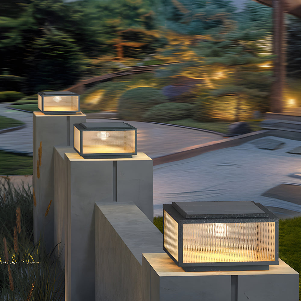 Multiple LED cube lights arranged on modern concrete steps creating sophisticated evening landscape design