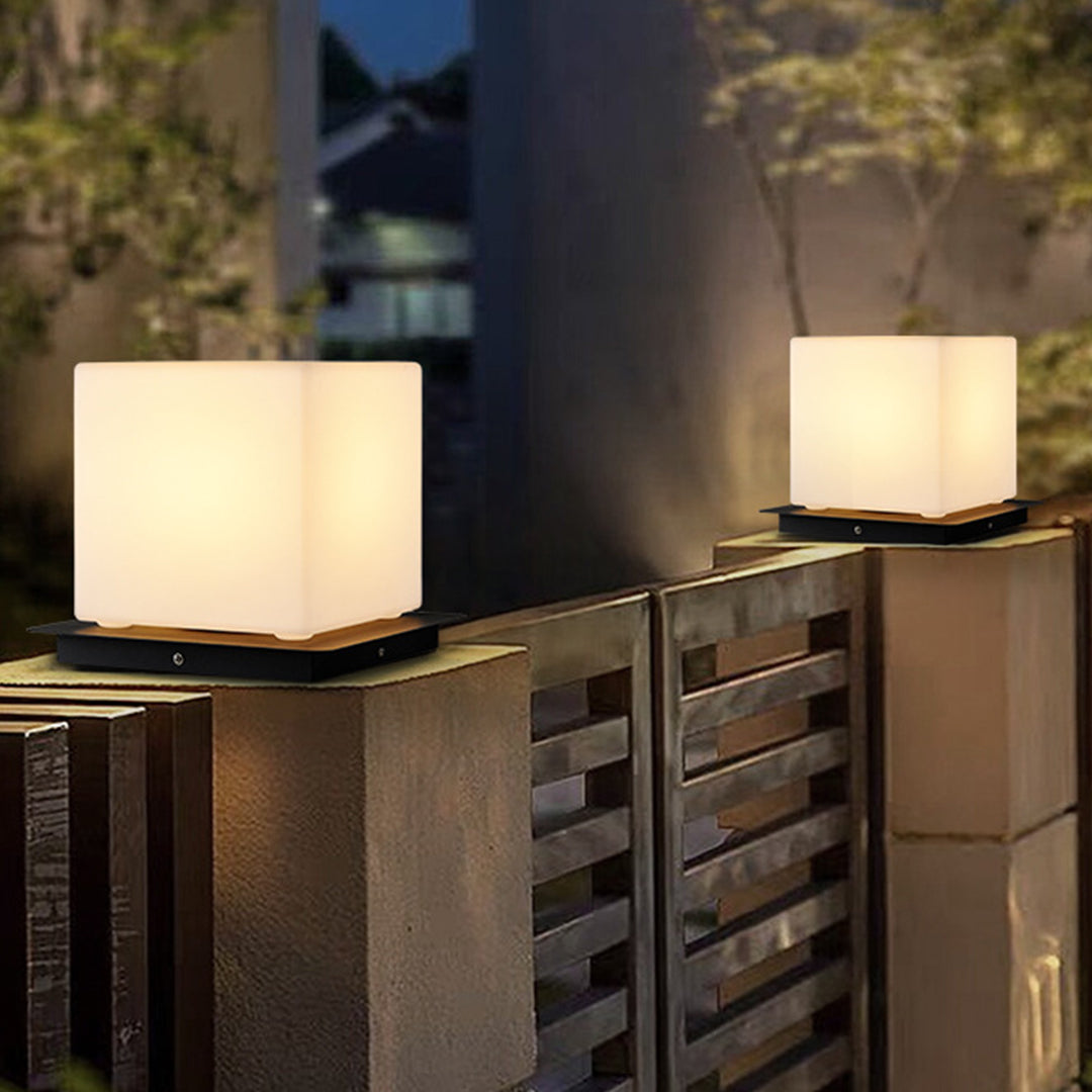 Contemporary LED cube lights positioned on modern wooden outdoor furniture with warm ambient glow