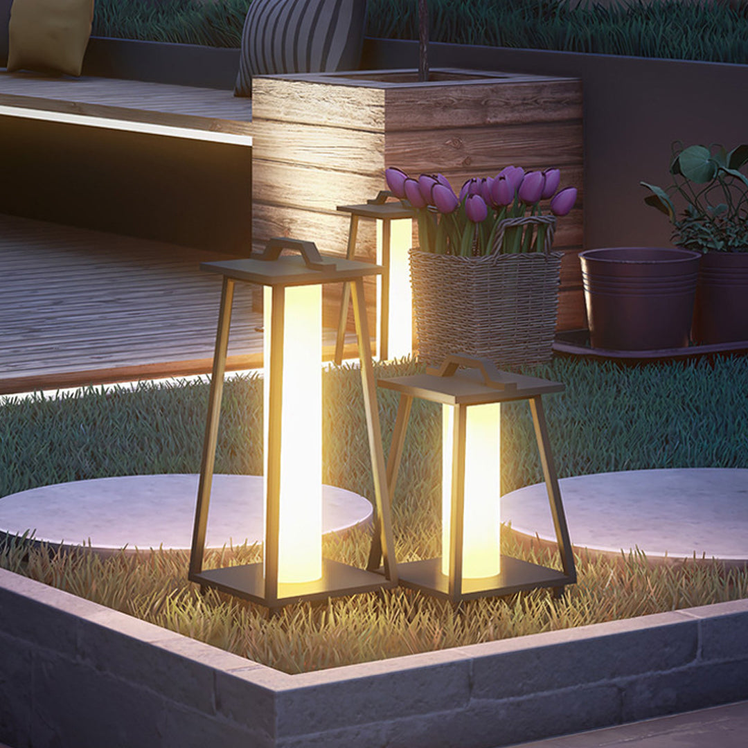 Modern LED lanterns creating dramatic accent lighting in minimalist garden landscape design
