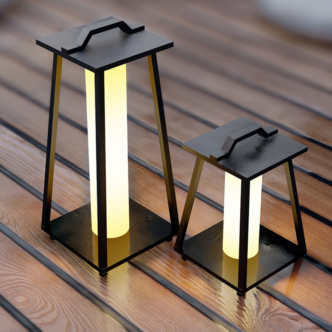 Multiple LED lanterns with handles arranged on wooden deck creating cozy evening atmosphere
