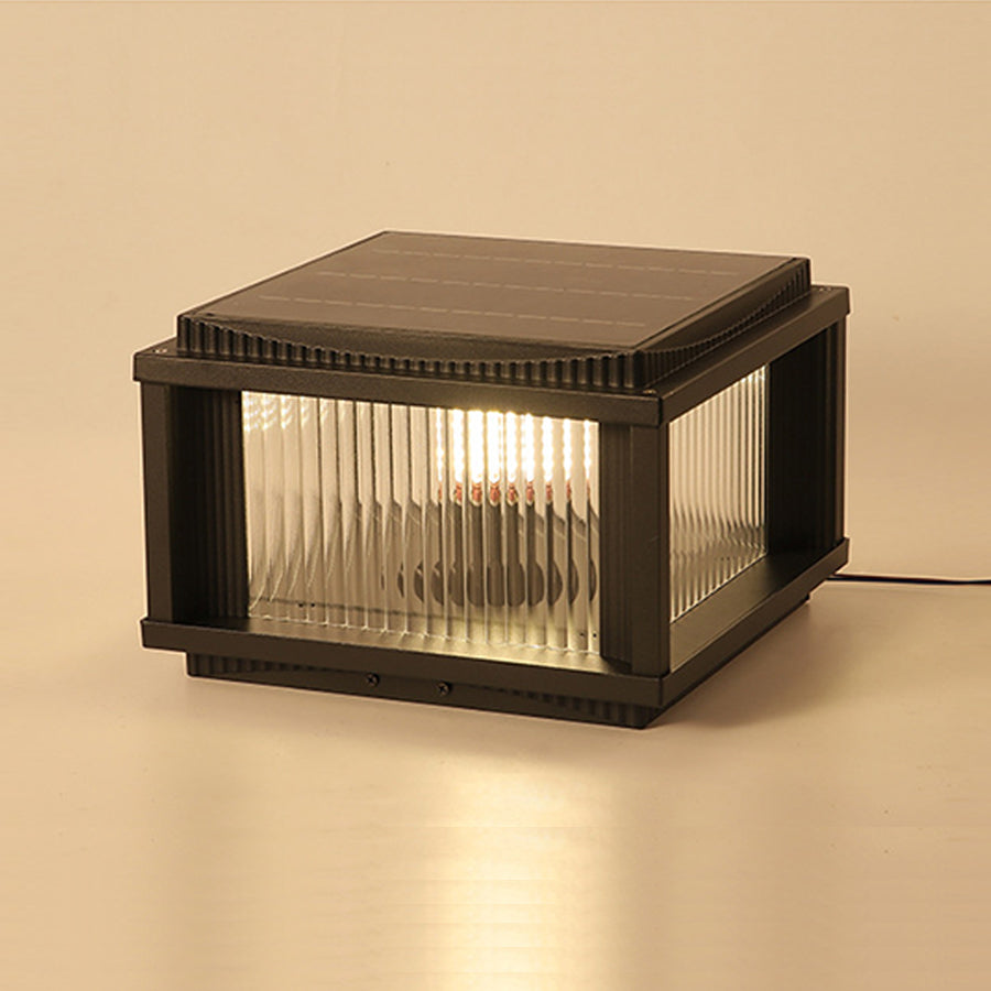 Indoor studio shot of modern solar light fixture with ribbed glass diffuser on neutral background