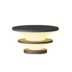 Multi-tier pendant light system with stacked circular elements in sophisticated monochrome design scheme
