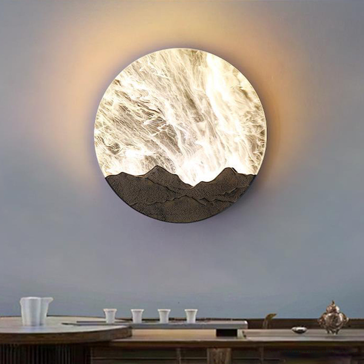 Modern office space featuring oversized circular wall art light as focal point design element