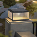 Contemporary outdoor lighting fixture installed on concrete surface creating warm geometric illumination pattern