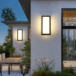 Outdoor patio area with multiple wall lights creating welcoming evening ambiance