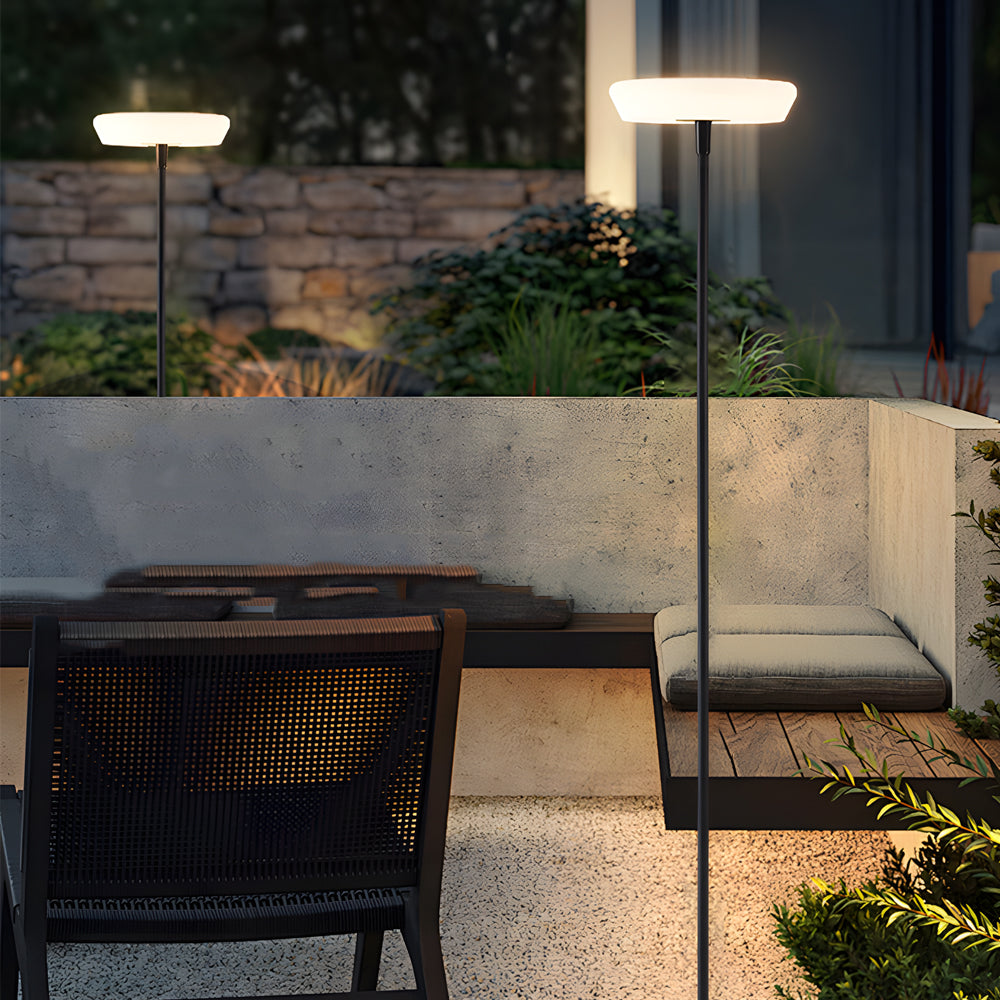 Floor lamp illuminating outdoor patio seating area