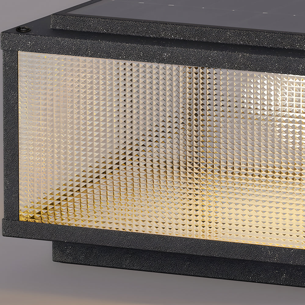Close-up detail of perforated metal mesh pattern creating textured light diffusion in modern fixture