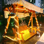 Garden pergola decorated with solar LED strip lights for cozy outdoor dining atmosphere