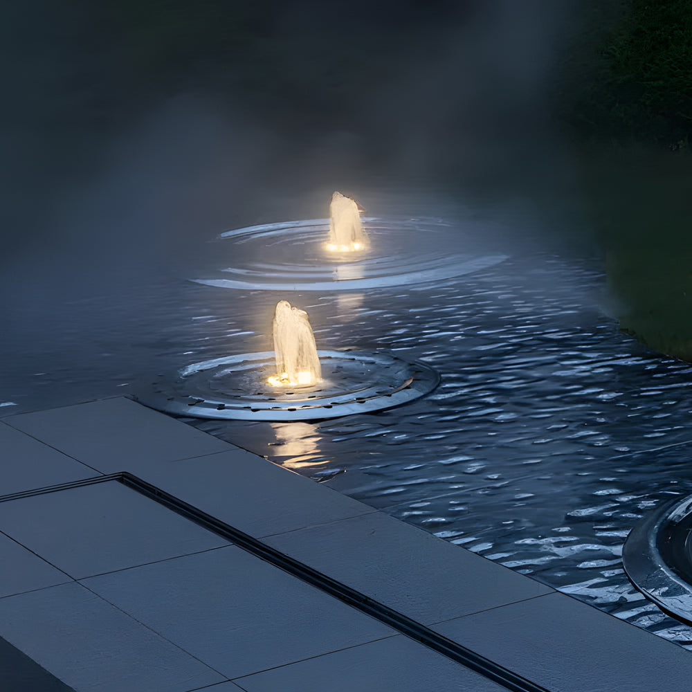 Modern pool deck with integrated underwater LED lights creating evening ambiance
