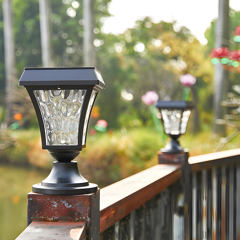 Modern post cap lights installed on wooden deck posts creating ambient outdoor lighting at dusk