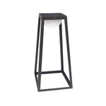 Modern pyramid-shaped outdoor light fixture with minimalist black framework construction
