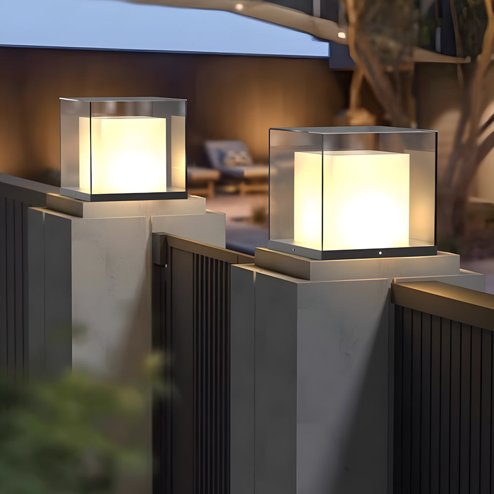 Multiple solar cube lights mounted on modern railing posts for pathway lighting