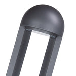 Cylindrical bollard base with rectangular light opening for directional illumination