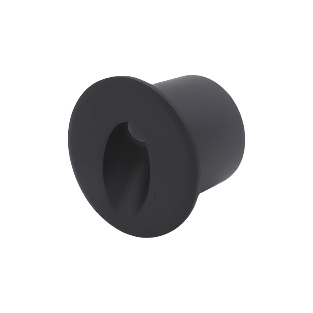Black circular recessed light fixture with hollow center opening