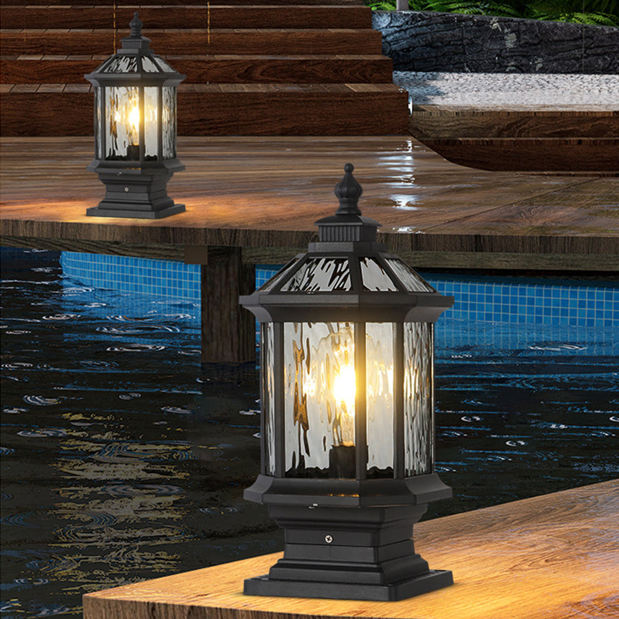 Rustic outdoor lantern with seeded glass creating warm poolside lighting at residential setting