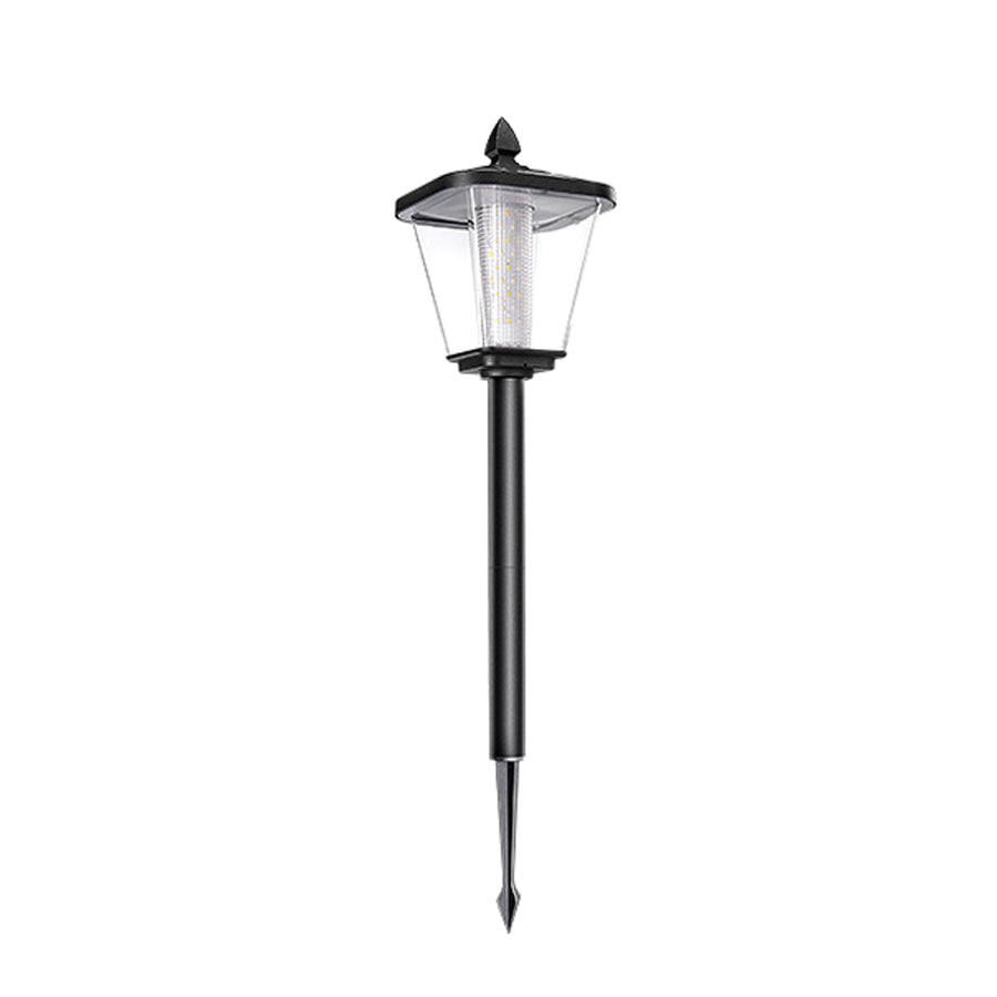 Elegant outdoor lighting fixtures illuminating landscaped slope beside contemporary building