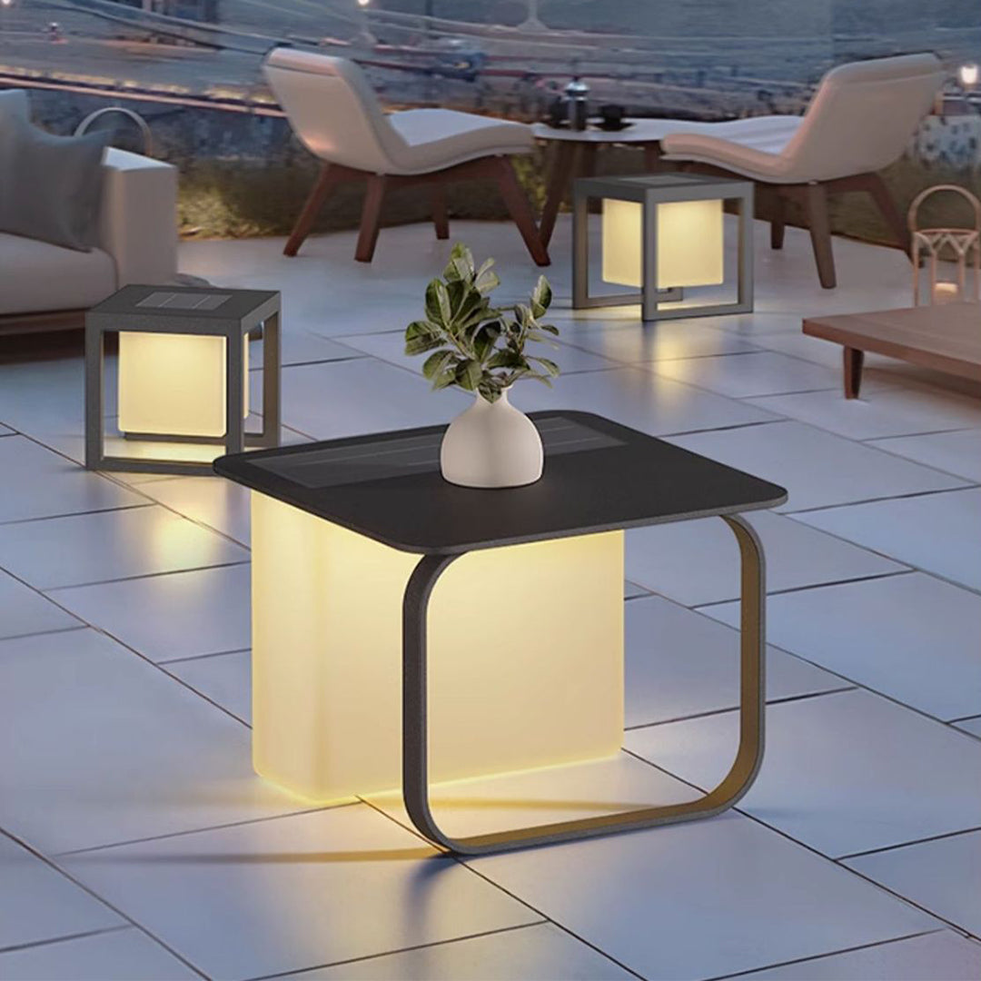 Solar-powered cube lights arranged on outdoor patio creating sophisticated evening lighting atmosphere