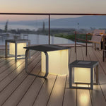 Elegant solar cube lights creating warm pathway lighting on contemporary wooden deck at dusk