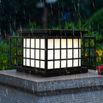 Solar-powered Japanese garden lantern with classic pagoda-style design providing ambient lighting in lush green landscape