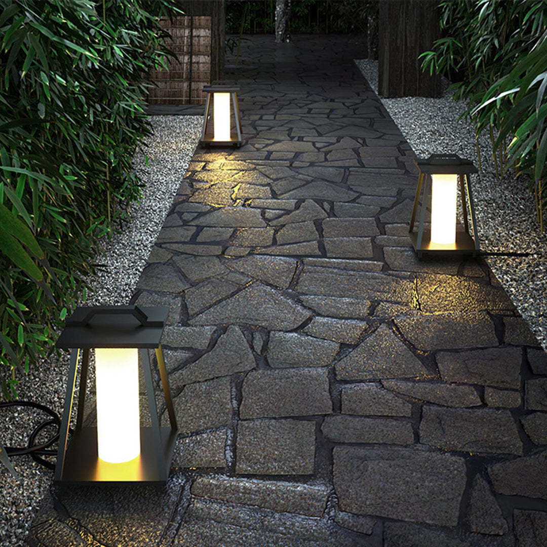 Solar-powered lanterns lining stone pathway through garden creating magical evening walkway illumination
