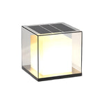Solar powered cube light featuring integrated top panel and warm LED illumination