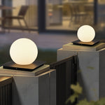 Elegant spherical and cubic LED lights displayed on sleek outdoor console creating dramatic evening lighting