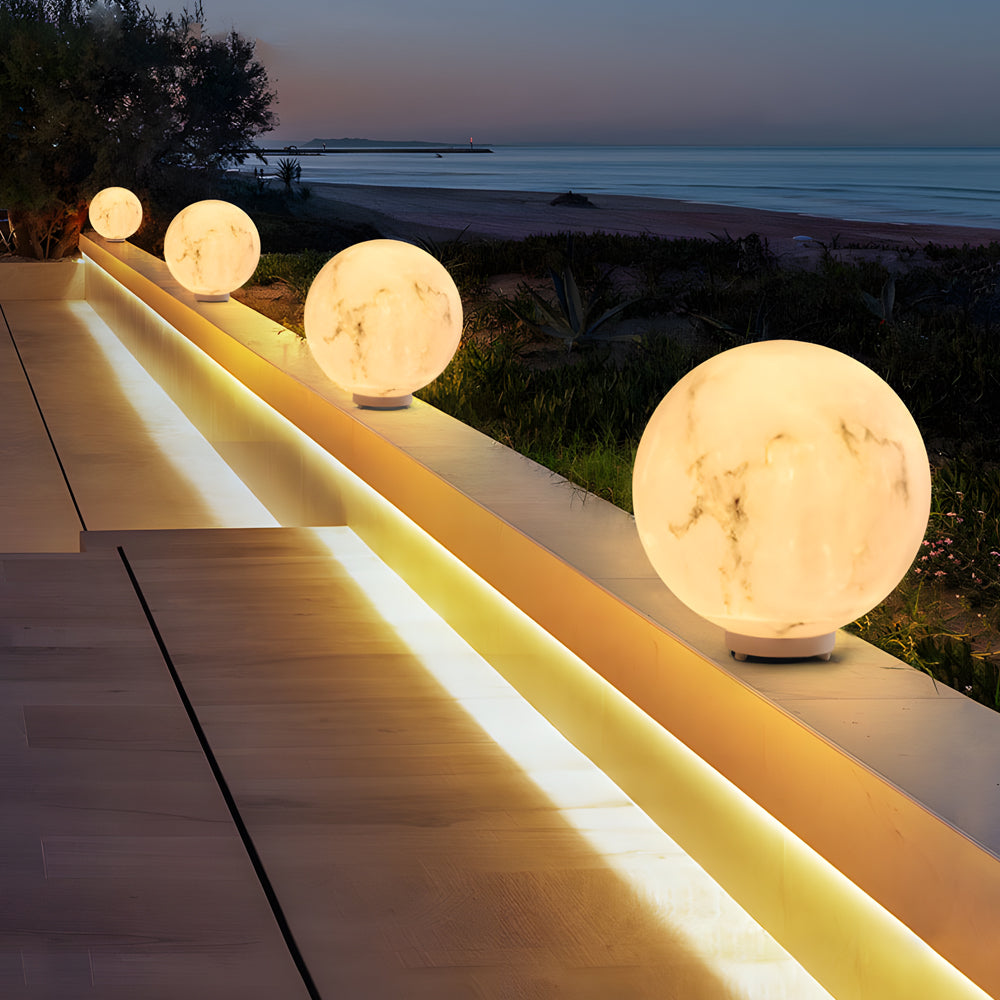 Modern outdoor staircase illuminated by floating moon sphere lights creating magical evening atmosphere