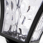 Close-up detail of textured glass panel showing water droplet pattern design on outdoor light fixture