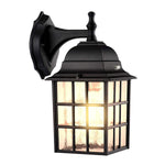 Traditional black lantern wall sconce with grid pattern glass panels and classic design