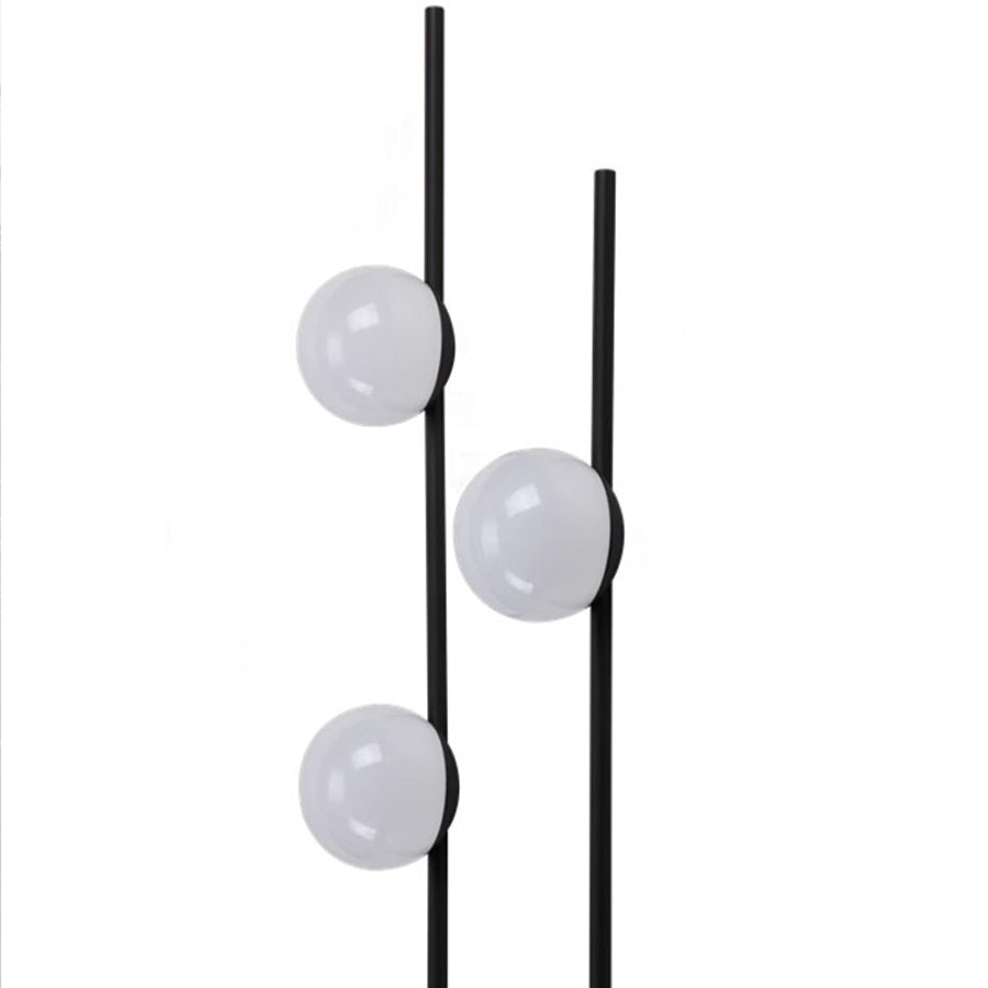 Series of white spherical lights arranged vertically on slender posts for decorative lighting