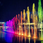 Modern water feature with underwater lighting highlighting flowing water design